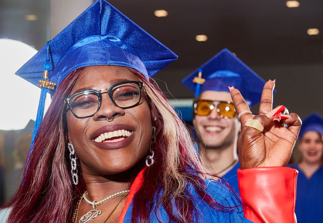 Candid photo of smiling graduates in their caps and gowns