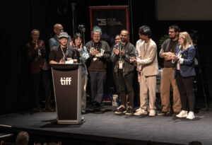 Cast and crew of Congratulations, It's a Girl on stage